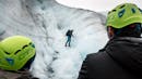 Person teaching other people how to ice climbing.