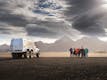 A truck near Katla Volcano Ice Cave with happy travelers.