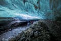A group of people exploring an ice cave.