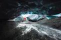 Person in distance touching the pieces of ice.