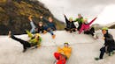 A group of happy people chilling and having fun on a glacier.