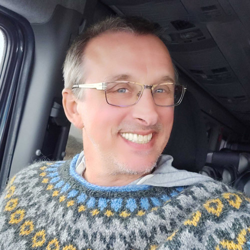 photo of a man inside a car