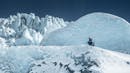 A person enjoying the time on a glacier.