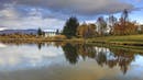 Autumn landscape reflecting on the river.